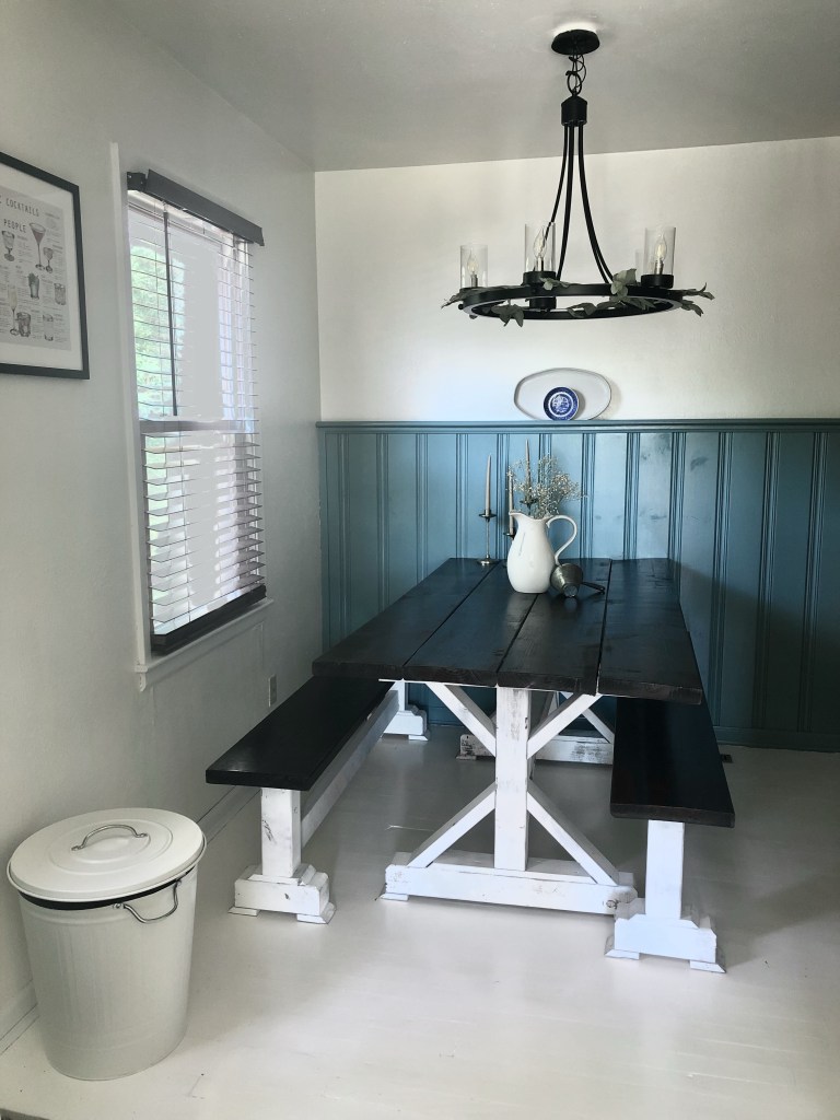 A large, walnut-stained dining table in a traditional dining room.