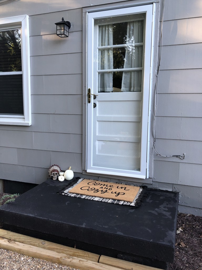A fall door stoop has just been decorated for the season.