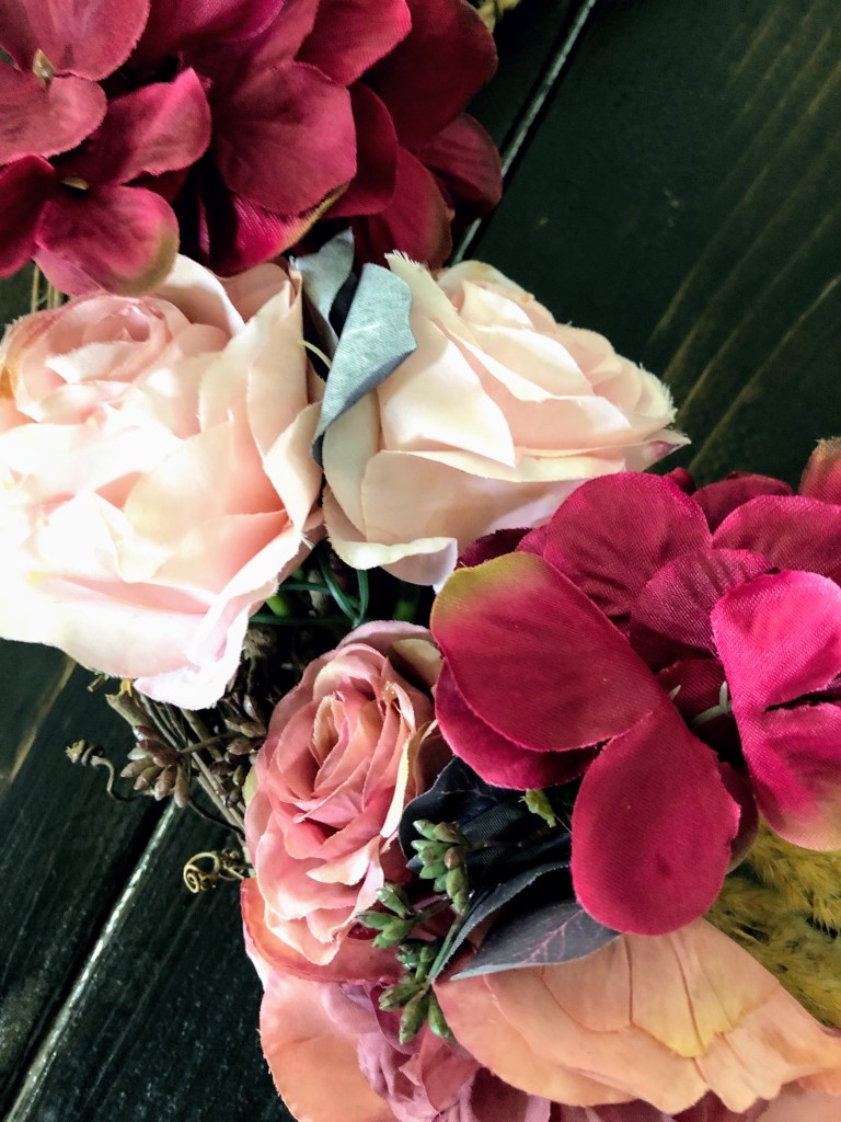 A close up of purple and pink flowers.