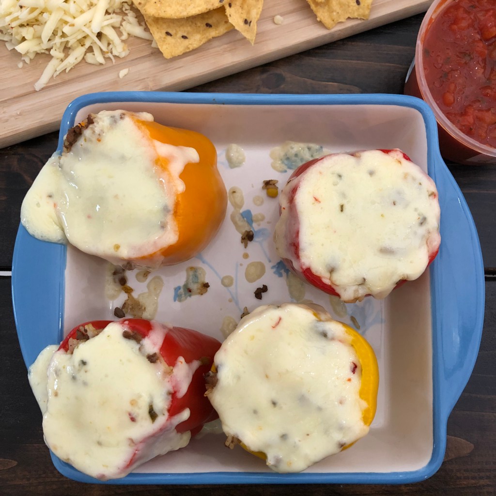 Vegetarian stuffed peppers are ready to be eaten after having been baked.