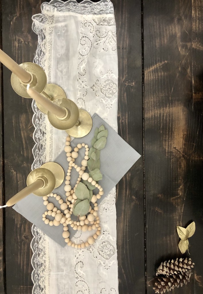 Candles and such sit on a table.