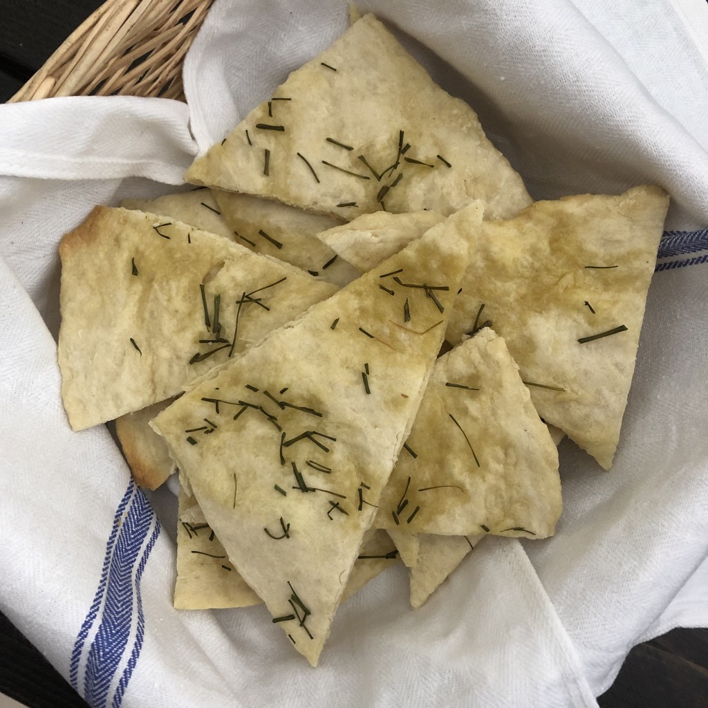 Easy flatbread has been baked and is ready to serve in a basket.