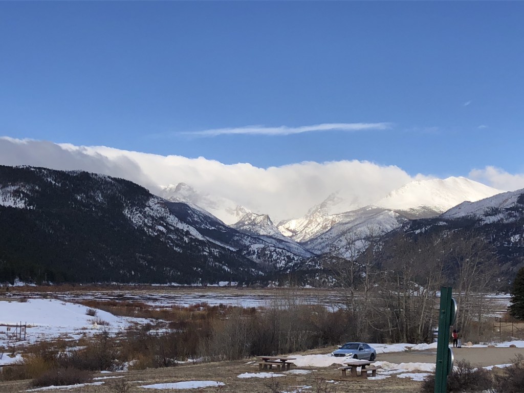 A gorgeous mountain backdrop is sprinkled with snow in late March.