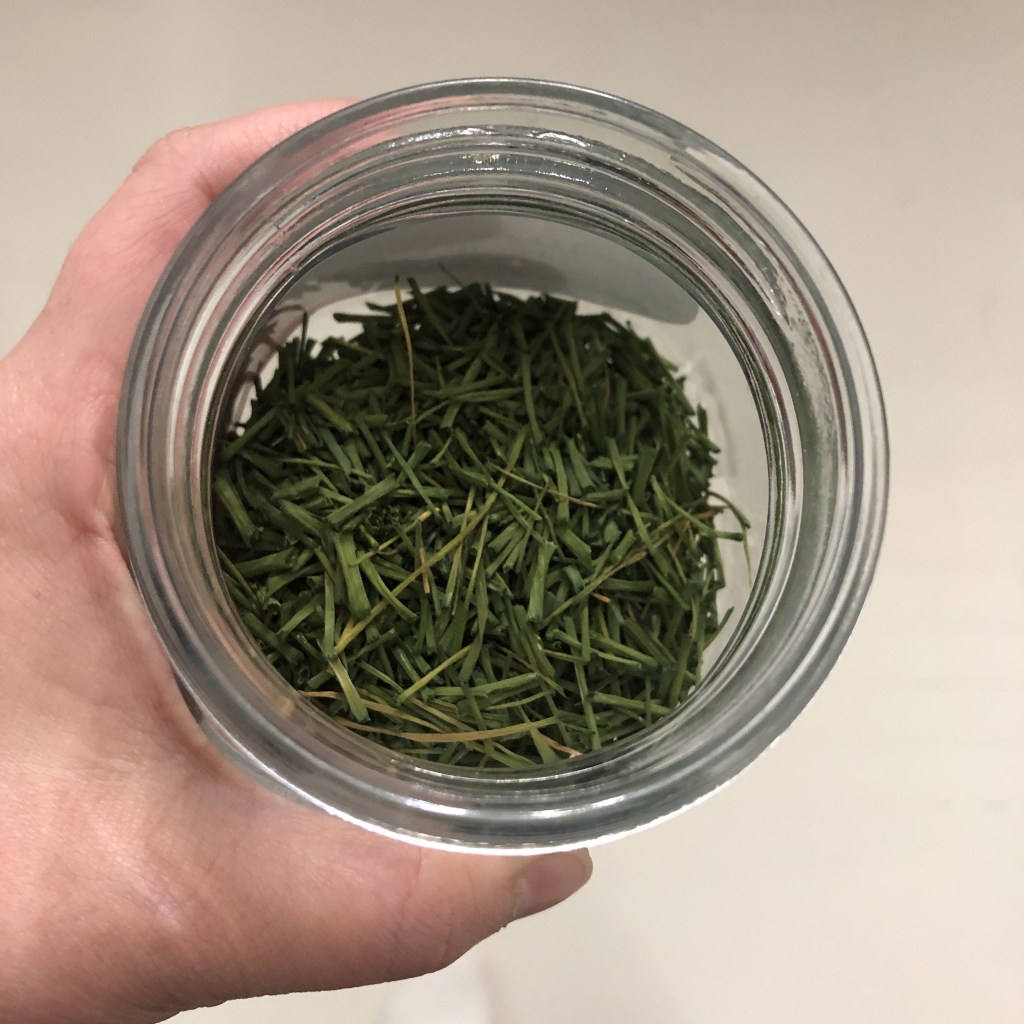 Dried chives from the garden are ready to be sprinkled on the flatbread dough.