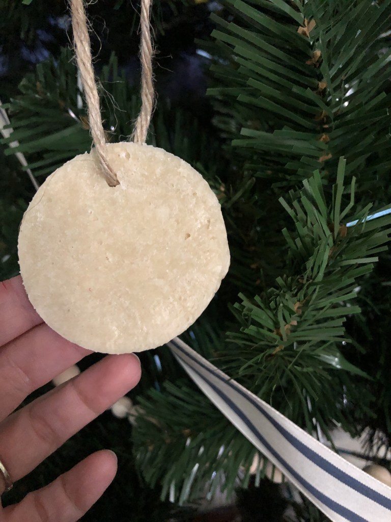A salt dough ornament is hung on a holiday tree this year. 