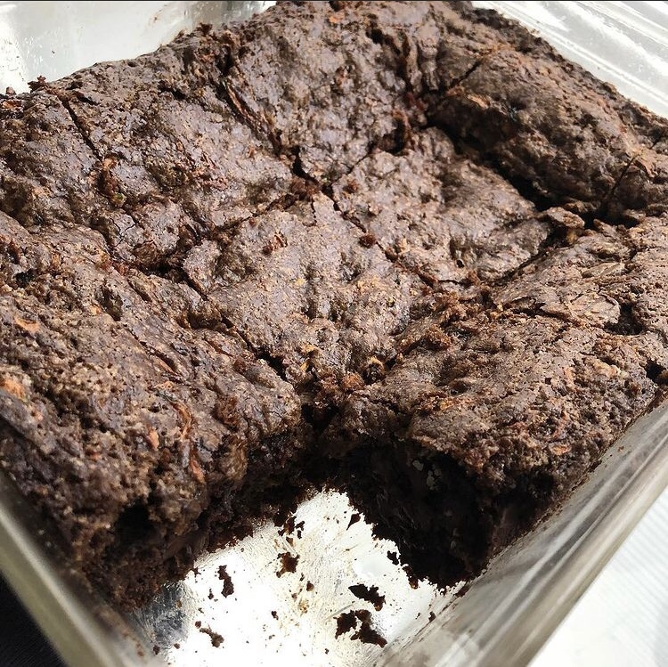 Chocolate brownies have been sliced and are ready for eating.