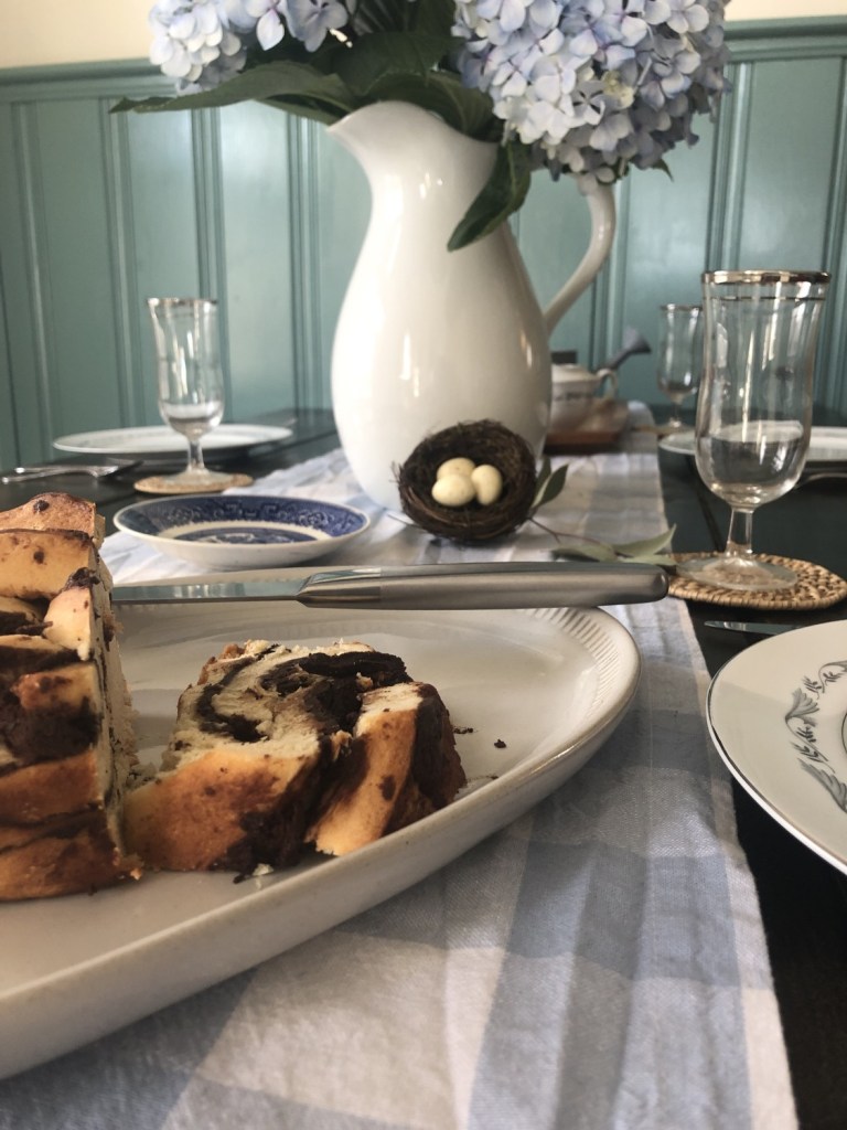 A checkered blue and white table runner runs the length of a long table.