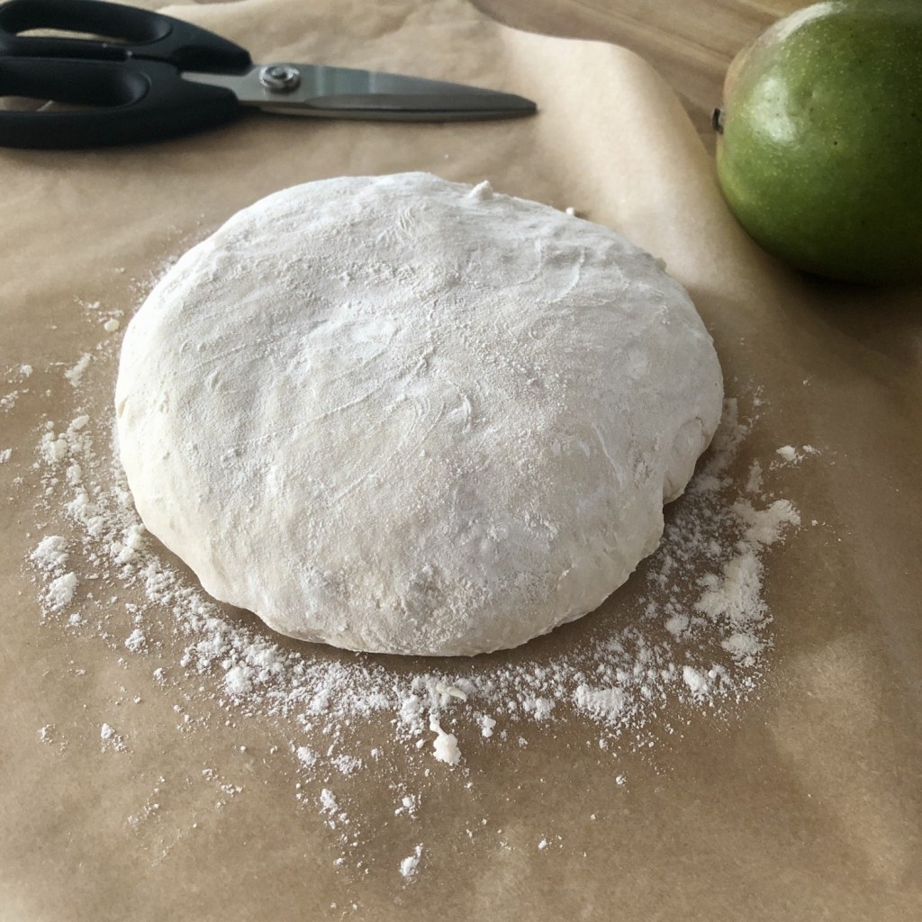 A ball of dough has been flour well before scoring.