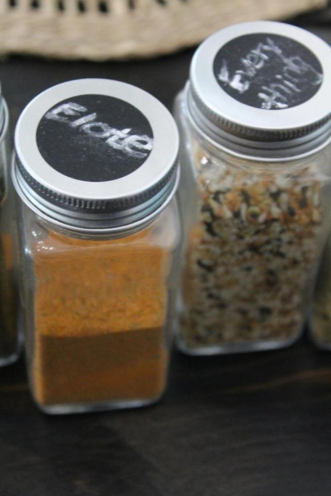 Spices are in their new jars after labels have been added.