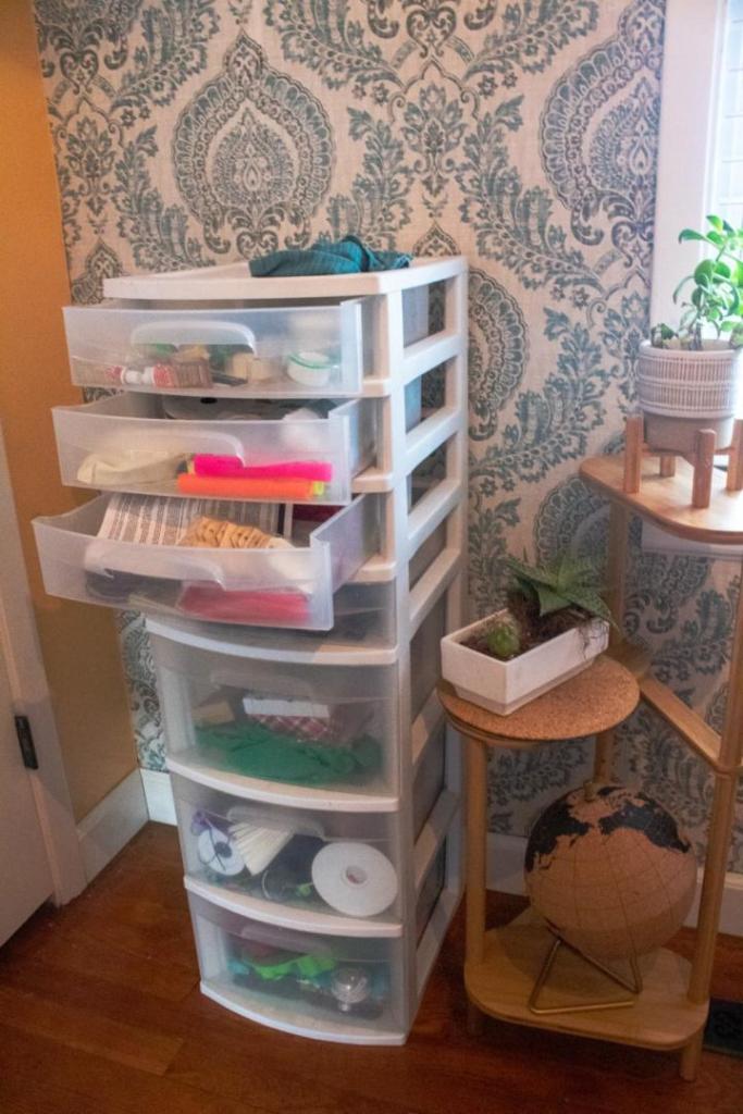A disorganized tower of plastic drawers is in serious need of craft drawer organization.