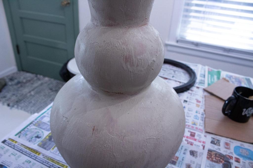 A vase has texture added to it for a stone look.