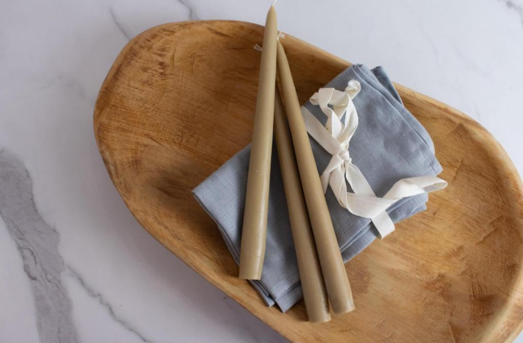 A wooden bowl has been bleached with Clorox for a raw wood look.