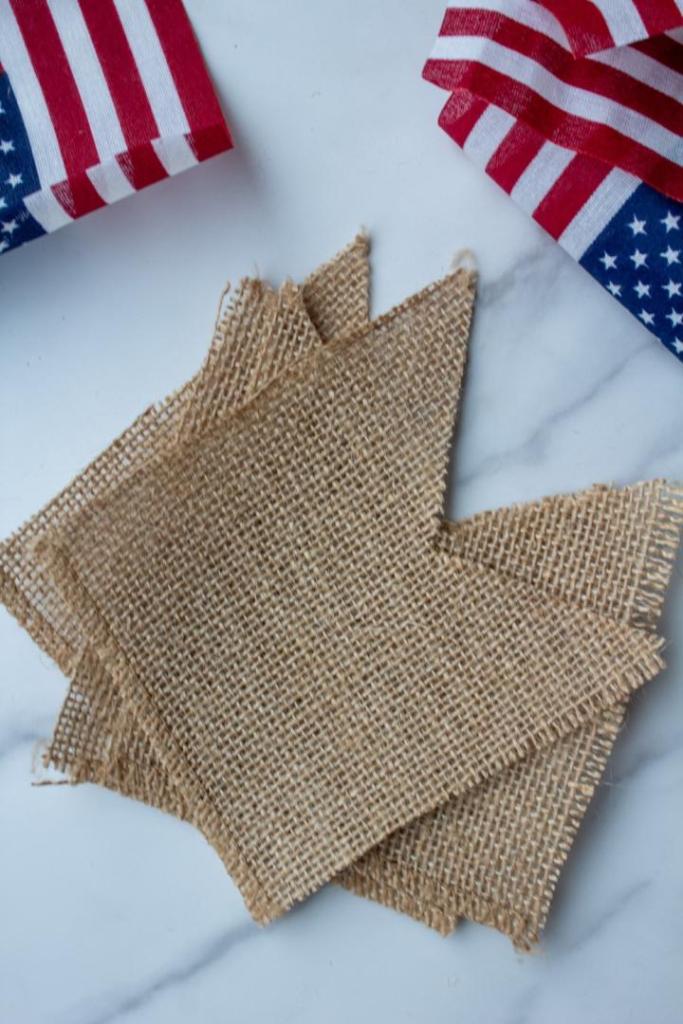 Burlap pieces are trimmed to look like ribbons.