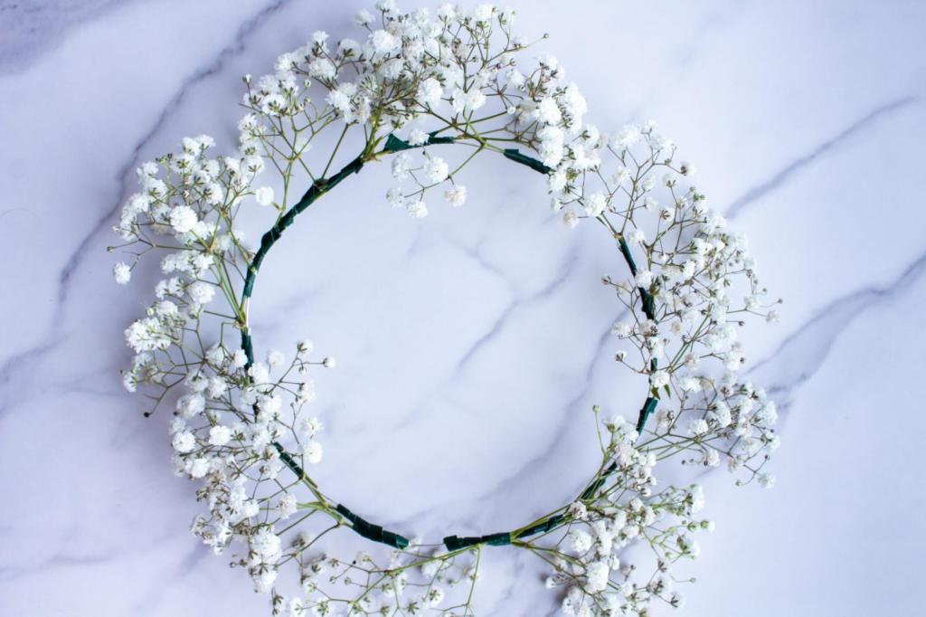 A floral crown is complete all the way around the base with baby's breath.