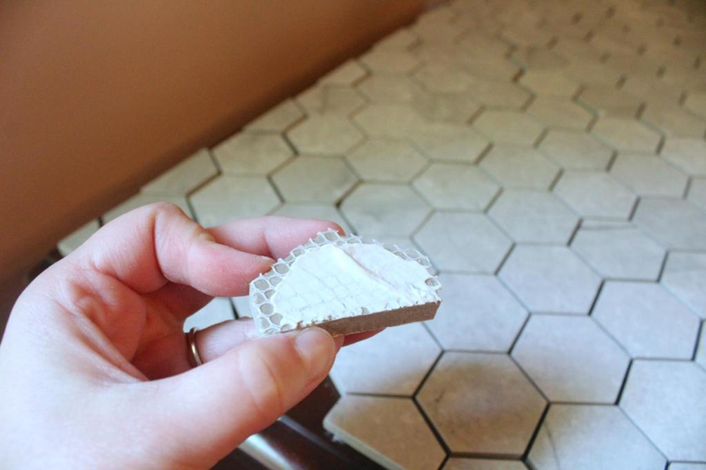Tile adhesive is added to the backs of tiles.