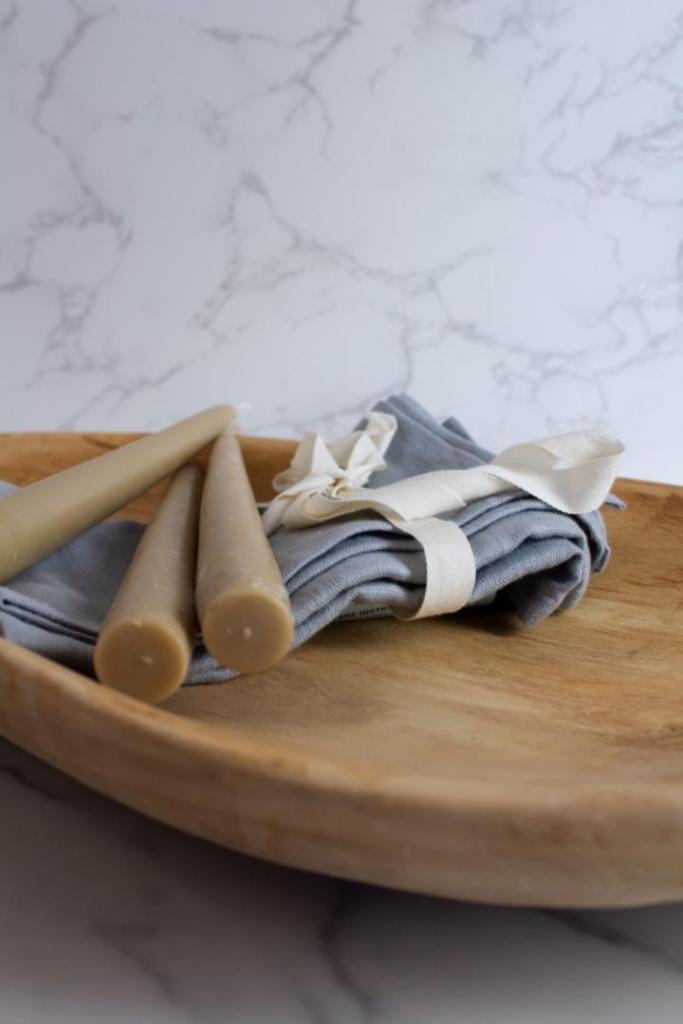 A wooden platter has been bleached using Clorox for a raw wood look.