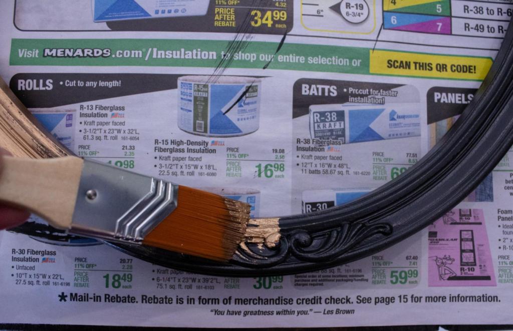 A dark painted frame has antique gold paint added to it for a vintage style.