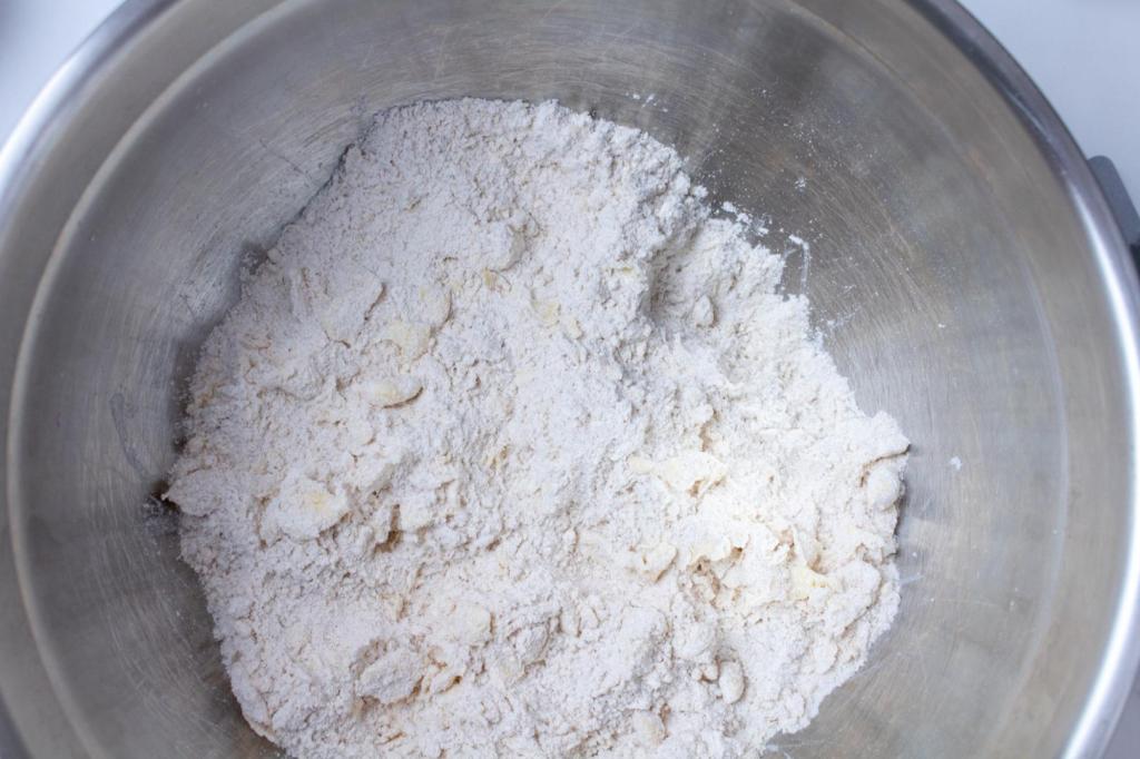 A crumbly mixture has been made in a mixing bowl.