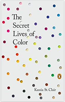 A book with colors dotted on it is shown.