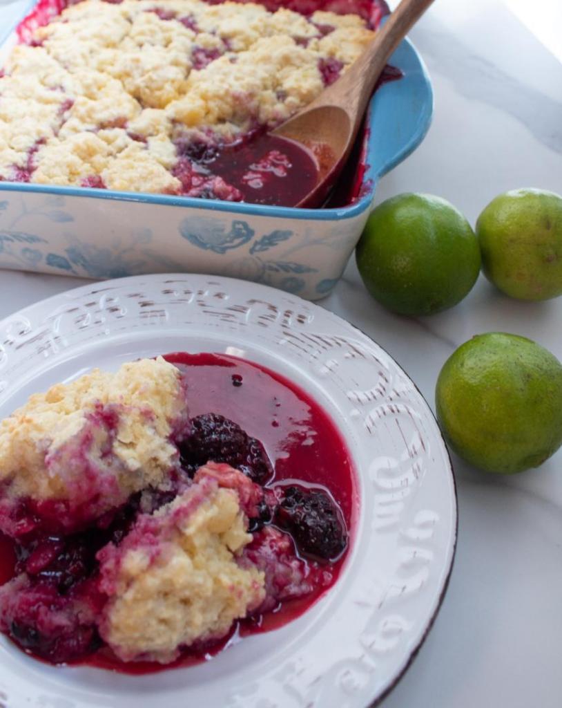 Blackberry cobbler is served on a small plate.
