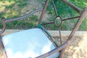 An old patio chair has been wiped clean.