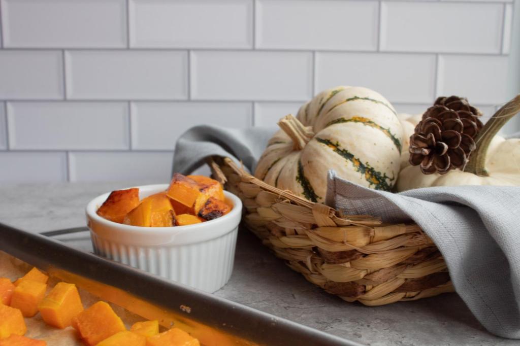 Learn how to roast butternut squash - a butternut squash is roasted and served in a ramekin near small pumpkins.