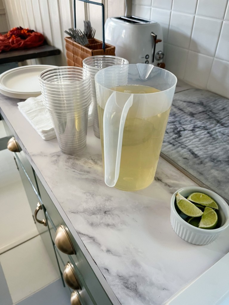 A little drink bar is set up for guests to help themselves.