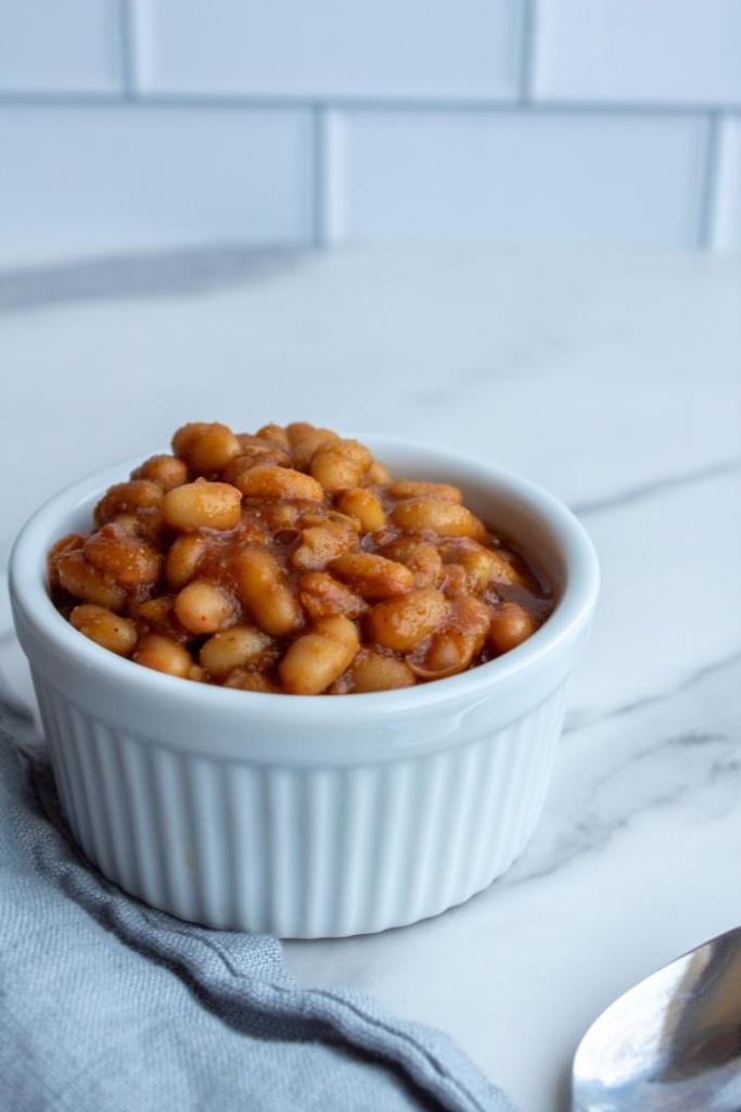 Crockpot vegetarian baked beans are served up in a ramekin.