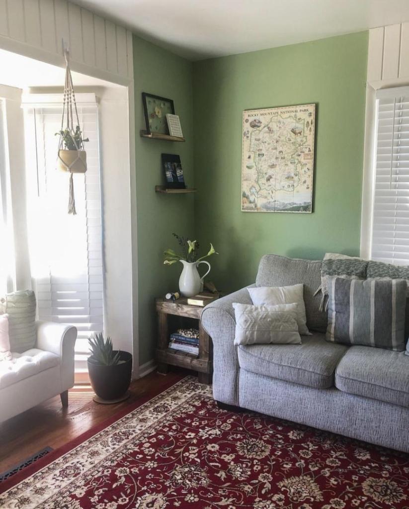 A living room has lots of pastels and florals.