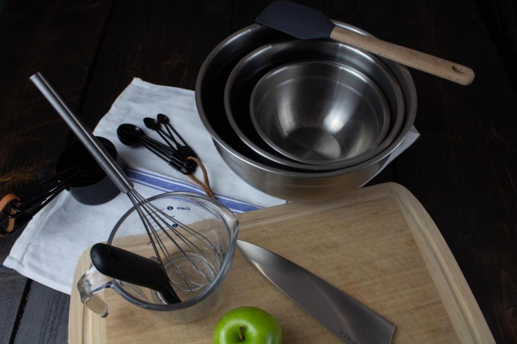 Baking equipment is set out on a dark dining room table.