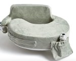 The my Brest friend nursing pillow is shown in green as a new mom breastfeeding essential.