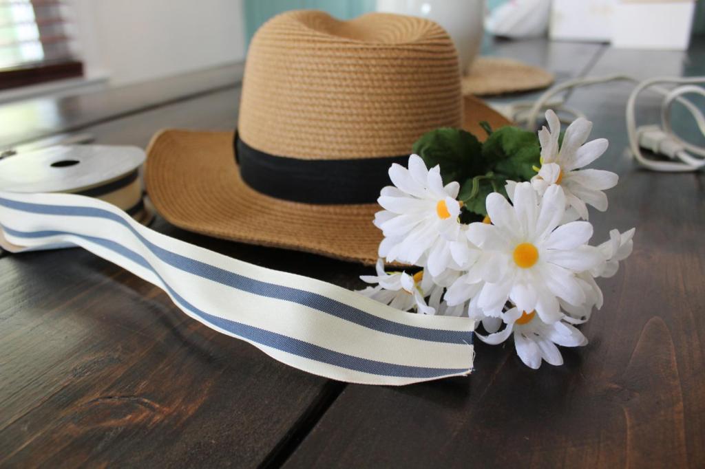 A sun hat waits to be revamped as a wreath.