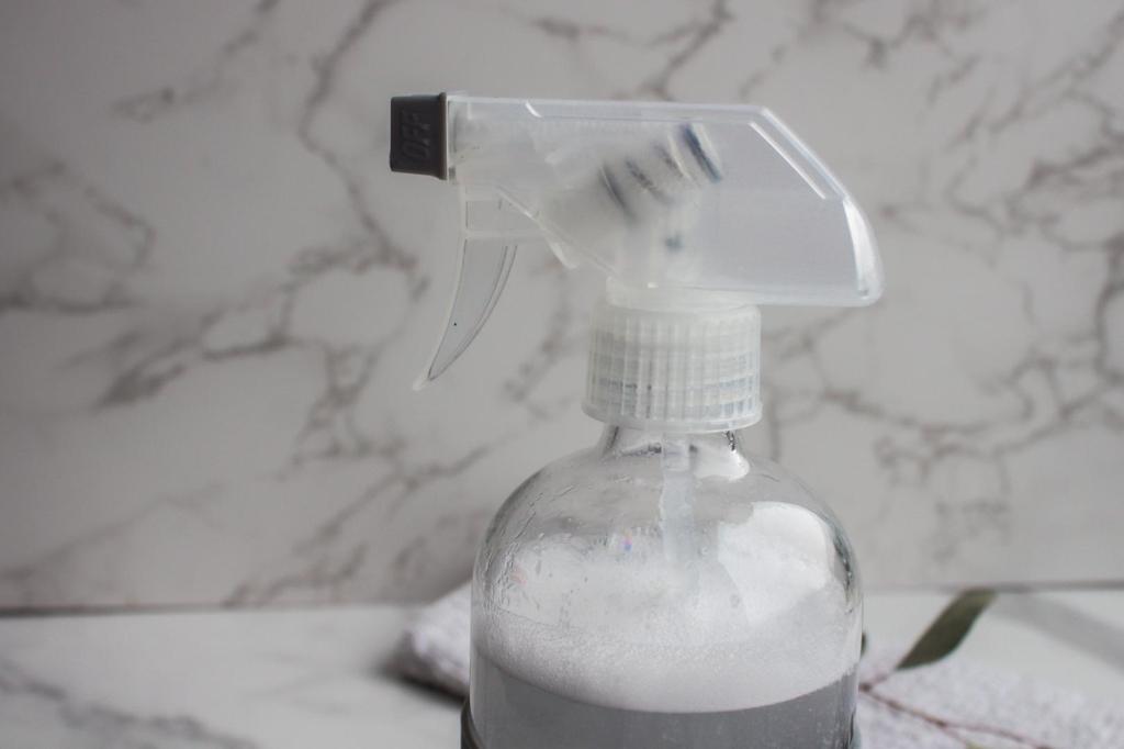 Soap foams up in a spray bottle.