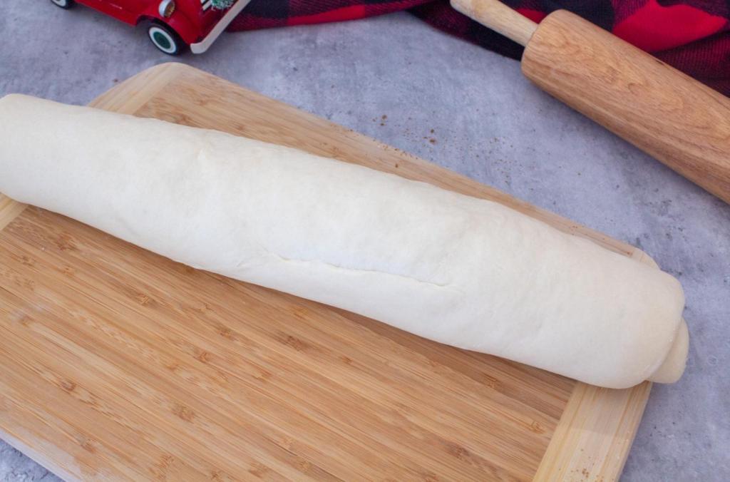 Dough is rolled into a long log, seam side down.