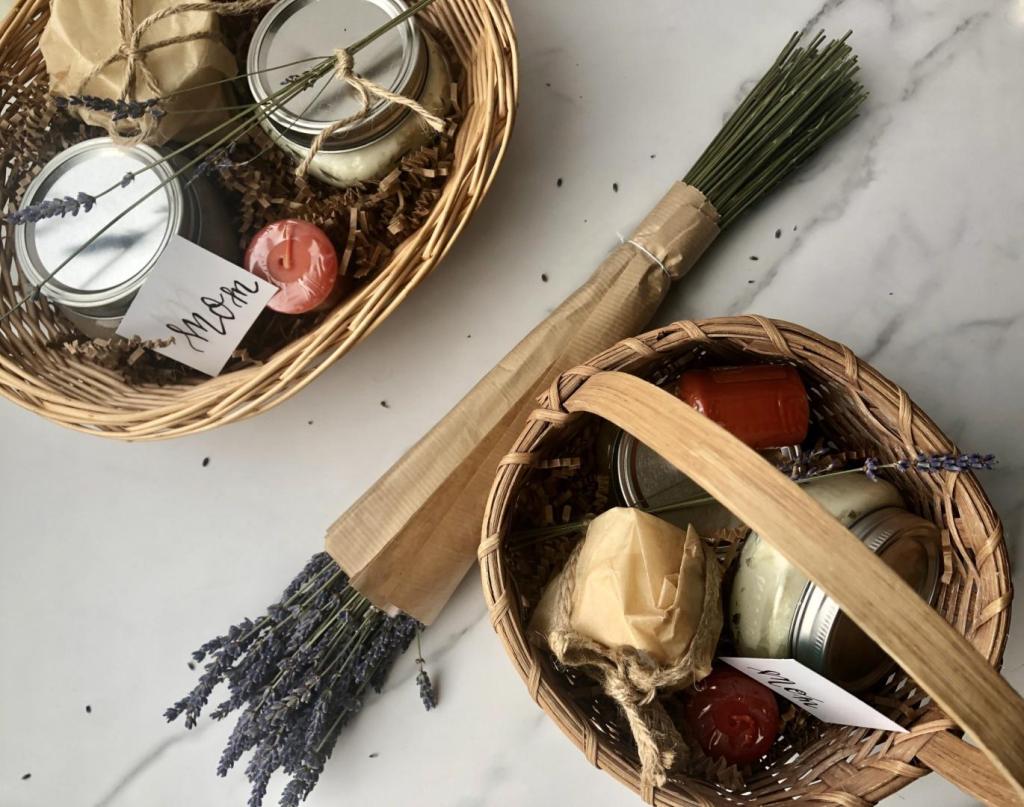 A Mother's Day gift basket idea consists of homemade bath and body products nestled into wicker baskets.