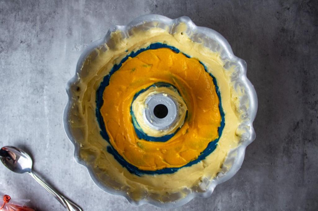 Yellow is the second layer added to a bundt cake pan.