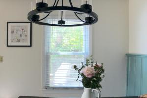 White window blinds are the star of this photo after learning how to paint window blinds.