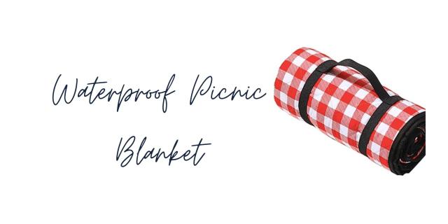 a cottagecore picnic blanket is checkered in red and white.