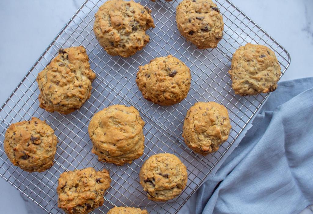 Lactation cookies are spread across a cooling rack to cool off.