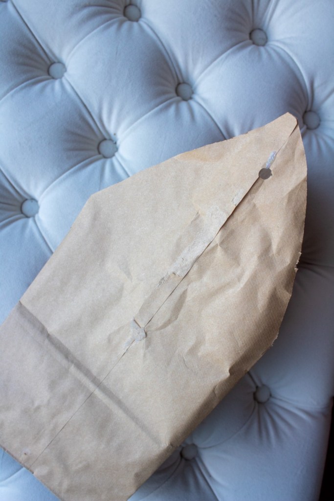 Snowflake points are created by cutting corners from paper sacks.