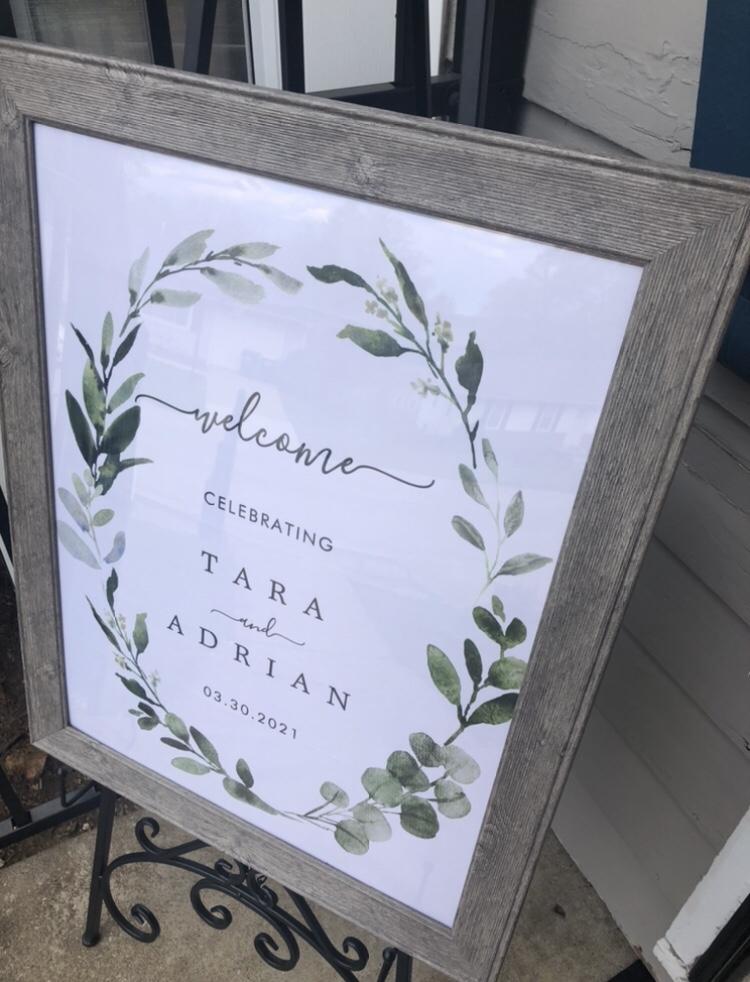 A sign is placed at the door of a home to welcome guests into a party.