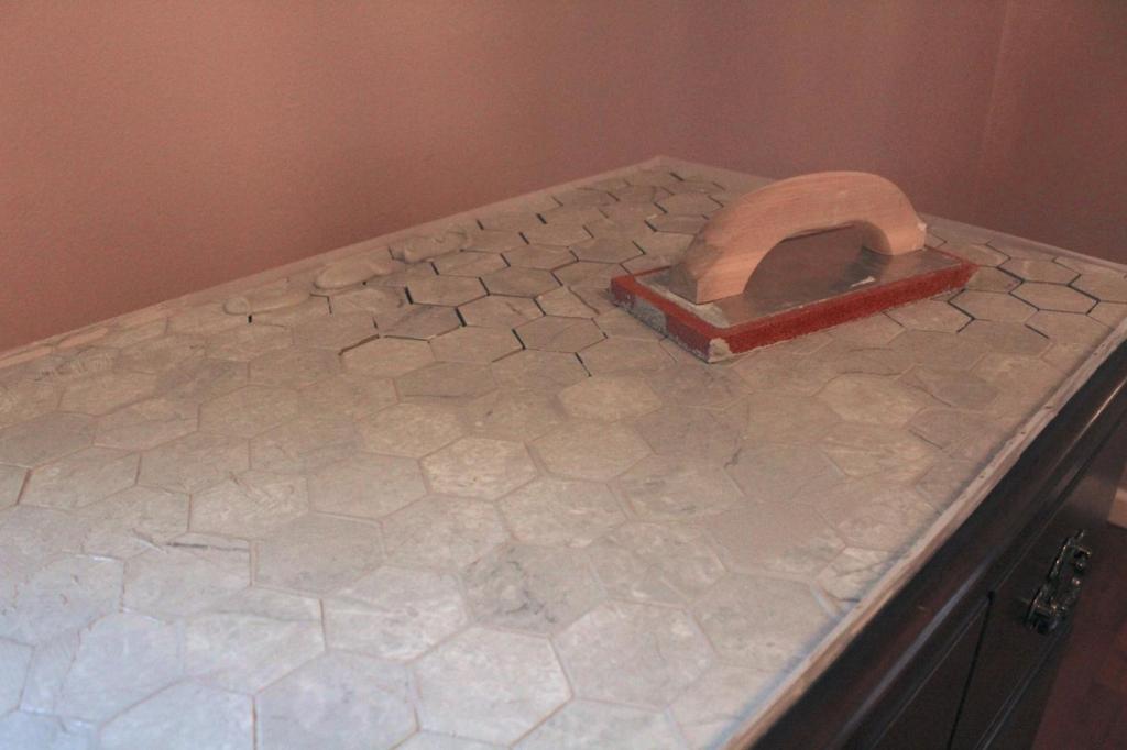 A grout float is used to smooth grout over tile joints.
