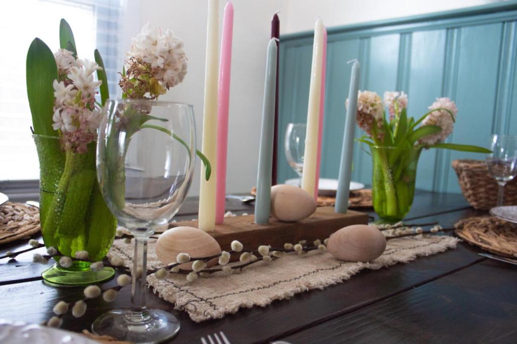 An Easter table setting is finished with final touches.