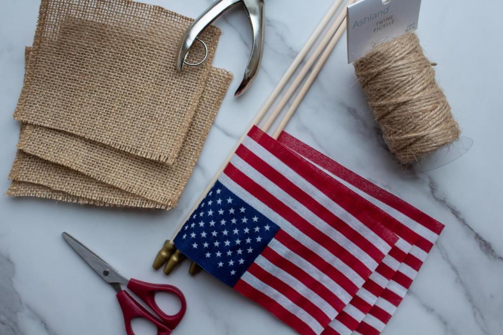 Lots of DIY Fourth of July banner supplies sit on a countertop.