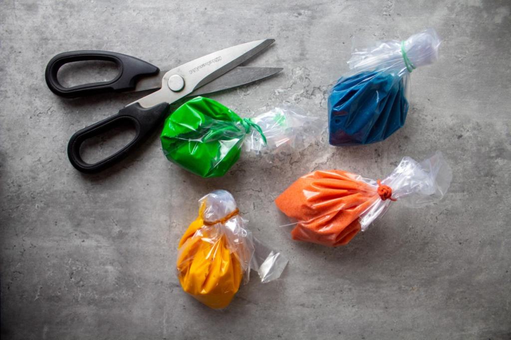 Four different bags are filled with different colors of cake batter.