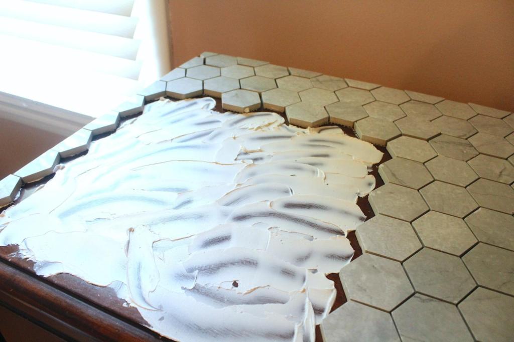 Tile adhesive is added to a dresser.