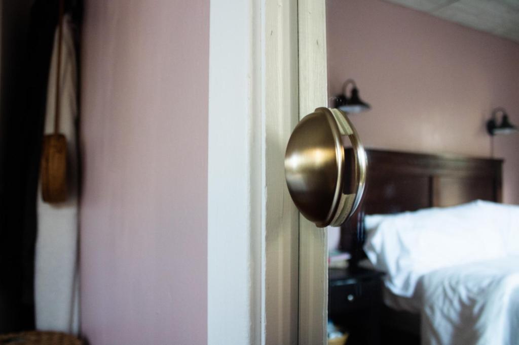 New door handles are added to an old mirror door.