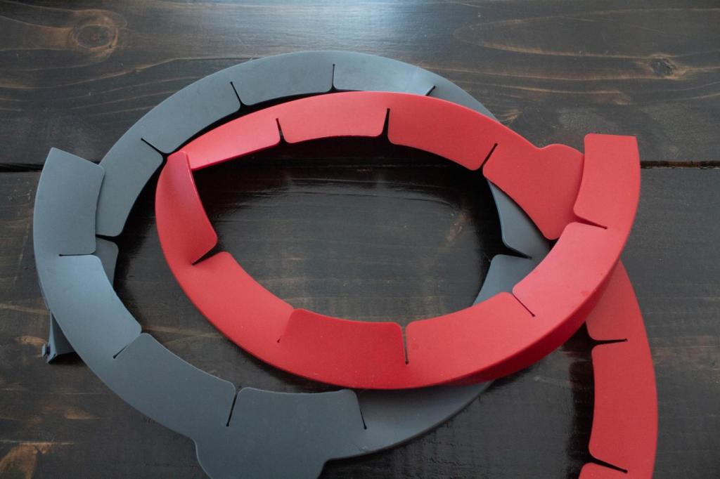 Pie shields are scattered on a table in red and grey.