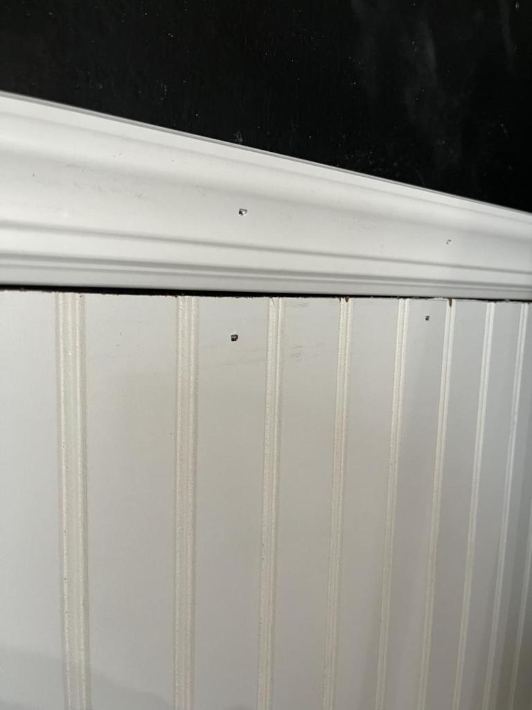 Chair moulding is added above beadboard paneling.