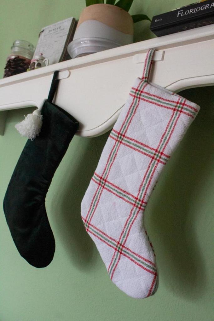 Stockings hang from a mantle.